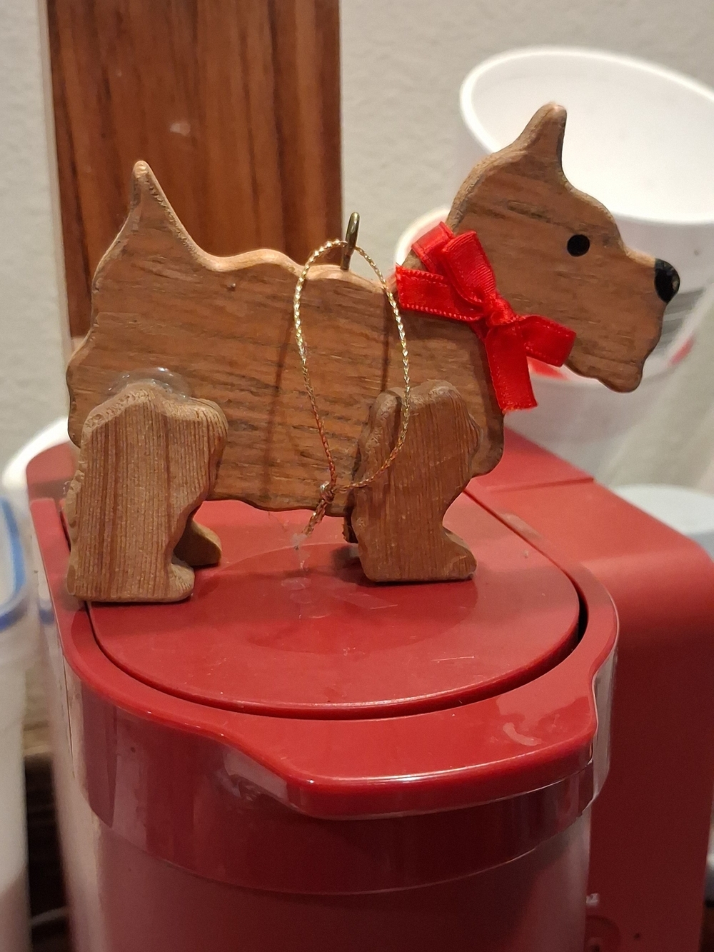 Handcrafted Wooden Dog Ornament with Red Bow